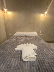 Una cama o camas en una habitación de Taguato