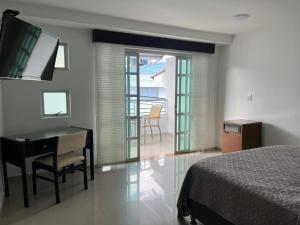 Ένα ή περισσότερα κρεβάτια σε δωμάτιο στο Hotel Villa María Coworking