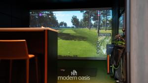 a television screen with a golf game on it at Modern CBD 2BR Free Gym & Pool Walk Everywhere in Melbourne