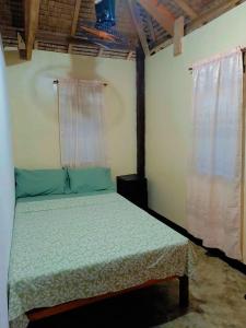 Кровать или кровати в номере Coastline Homestay