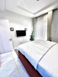 Voodi või voodid majutusasutuse An open-plan condo toas