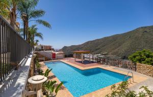 a swimming pool with a view of a mountain at Stunning Apartment In Albuñol With Wifi in Albuñol