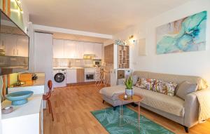 a living room with a couch and a table at Stunning Apartment In Albuñol With Wifi in Albuñol