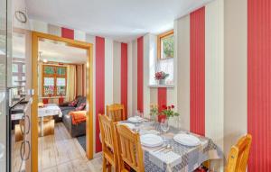 a kitchen and dining room with a table and chairs at Ferienwohnung Bodstedt in Bodstedt