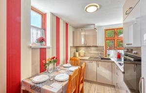 a kitchen with a table with two plates on it at Ferienwohnung Bodstedt in Bodstedt