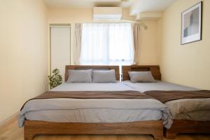 Postel nebo postele na pokoji v ubytování Verdant 601