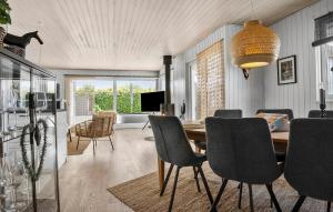 a dining room with a table and chairs at Beautiful Home In Egernsund With Wifi in Egernsund