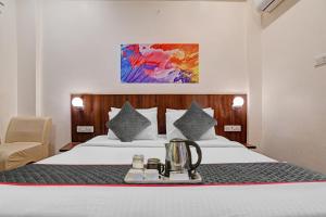 Townhouse Hotel O Benchmark客房内的一张或多张床位