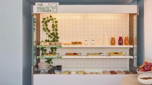 a shelf with food on it in a store at Hotel Indigo Albufeira by IHG in Albufeira