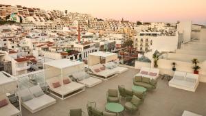 a view of a city from the roof of a building at Hotel Indigo Albufeira by IHG in Albufeira
