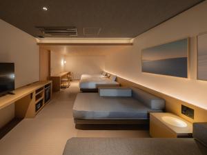 Letto o letti in una camera di Dansetsu Sapporo - Opening in Apr 2025