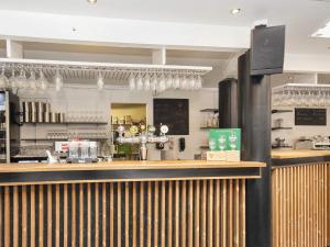 a bar in a restaurant with a counter at Holiday home with sauna, whirlpool- Type1 in Blåvand +23 photos