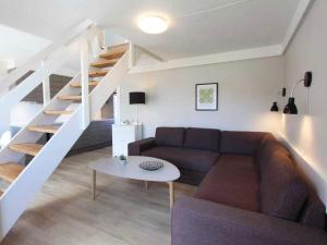 5 person holiday home on a holiday park in Gudhjem的休息区