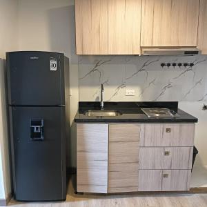 Η κουζίνα ή μικρή κουζίνα στο Torre Ventto Loft 24-7