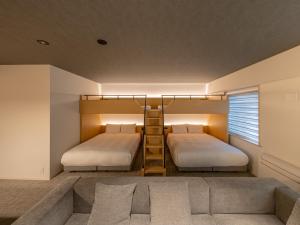 Letto o letti in una camera di Dansetsu Sapporo - Opening in Apr 2025