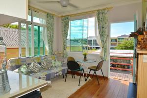 a living room with a couch and a table at Rafiki Homestay in Kota Kinabalu