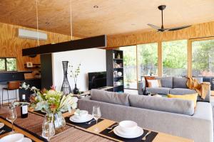 a living room with a couch and a table at Jacquina - Yarra Valley in Healesville