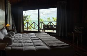 Postel nebo postele na pokoji v ubytování Hotel Cabañas María Isabel, Bacalar
