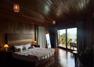 Postel nebo postele na pokoji v ubytování Hotel Cabañas María Isabel, Bacalar