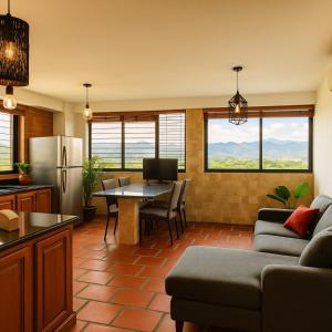 a kitchen and living room with a couch and a table at Comfort and a perfect location in Valencia