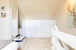 Postel nebo postele na pokoji v ubytování Tunghoern-Hues-1-OG-Wohnung-08
