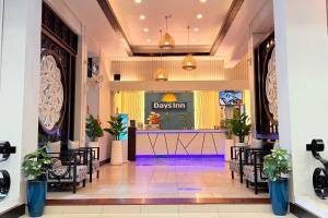 a lobby of a department store with a waiting area at Days Inn by Wyndham Patong Beach in Patong Beach