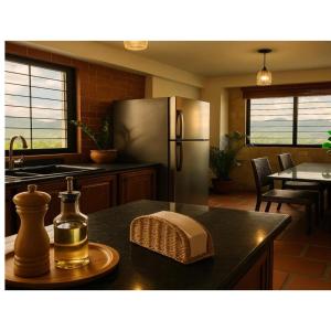 a kitchen with a stainless steel refrigerator and a table with a plate at Comfort and a perfect location in Valencia