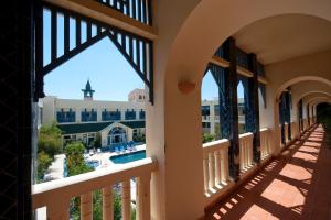 a view of the pool from the balcony of a resort at Diar Lemdina Hotel in Hammamet