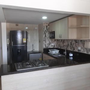 Kuchyň nebo kuchyňský kout v ubytování Confortable