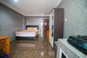 Voodi või voodid majutusasutuse Cibubur Village Apartment Kaisar Property by MHM toas