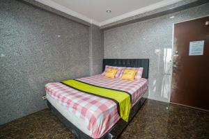 Voodi või voodid majutusasutuse Cibubur Village Apartment Kaisar Property by MHM toas