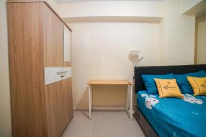 Voodi või voodid majutusasutuse Cibubur Village Apartment Kaisar Property by MHM toas