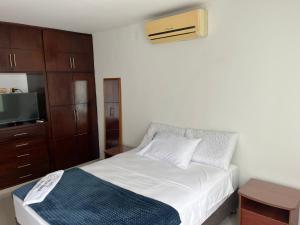 Ένα ή περισσότερα κρεβάτια σε δωμάτιο στο Hotel Villa María Coworking