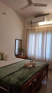 Postel nebo postele na pokoji v ubytování Purayilhomestay