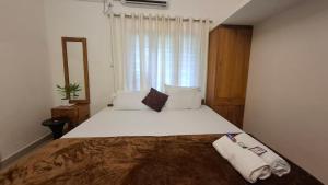 Postel nebo postele na pokoji v ubytování Purayilhomestay