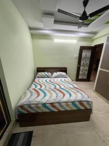 Postel nebo postele na pokoji v ubytování Anand Paradise