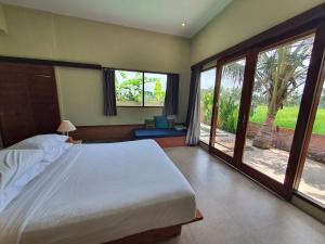 Ένα ή περισσότερα κρεβάτια σε δωμάτιο στο Cozy Mudram One Bedroom Private pool W Kitchenette