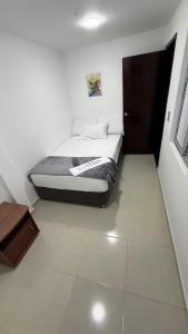 Ένα ή περισσότερα κρεβάτια σε δωμάτιο στο Hotel Villa María Coworking