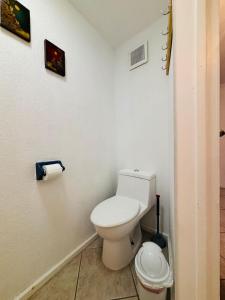 a bathroom with a white toilet in a room at Oceanview Casita 1BR 1 5BA with pool in Rosarito