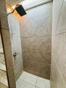 a shower with a glass door in a bathroom at Oceanview Casita 1BR 1 5BA with pool in Rosarito +24 photos