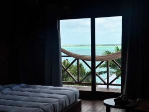 Postel nebo postele na pokoji v ubytování Hotel Cabañas María Isabel, Bacalar