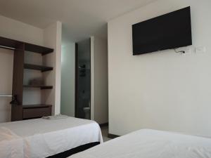 Letto o letti in una camera di Suite Privada, Aire Acondicionado, Balcon y Piscina