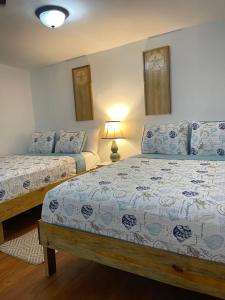 Voodi või voodid majutusasutuse Habitacion triple toas