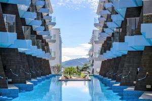Bazén v ubytování The Beachfront Hotel Phuket nebo v jeho okolí + 37 fotografií