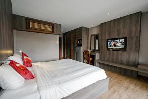 Postel nebo postele na pokoji v ubytování Naiya Buree Boutique Resort