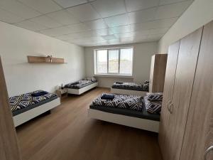 Posteľ alebo postele v izbe v ubytovaní Skodova 4 Apartments