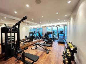 a gym with treadmills and cardio equipment in a building at The Paradise Kingdom in Kanchipuram