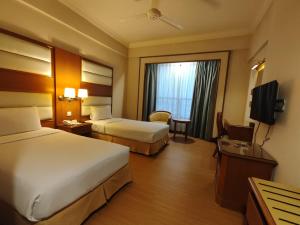 Postel nebo postele na pokoji v ubytování Pearl View Hotel Prai, Penang