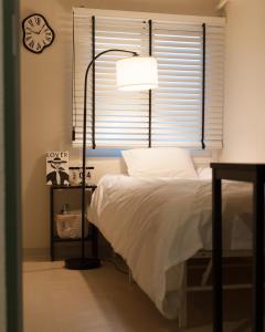 Ένα ή περισσότερα κρεβάτια σε δωμάτιο στο Pocket Seoul Branch 2