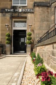 a building with a door with flowers in front of it at The Hostel in Edinburgh